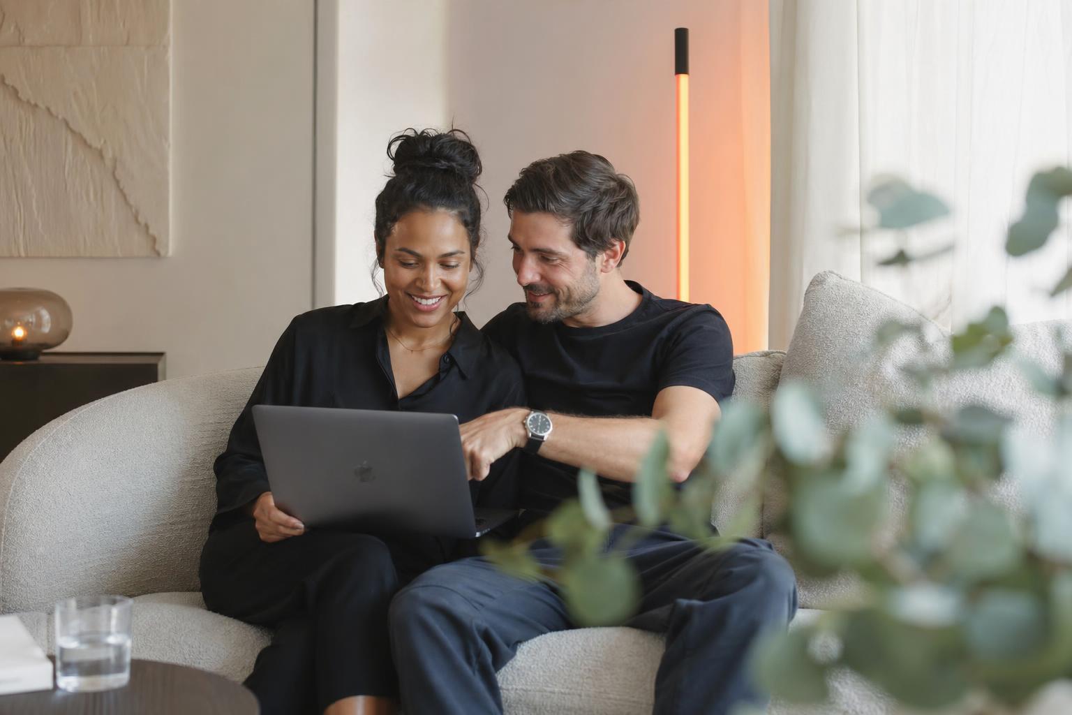 Couple reviewing personal loan options on a laptop together